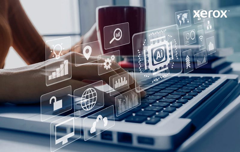Hands typing on a laptop with digital icons symbolizing AI and data analytics overlayed.